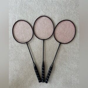 Trio of Black and Pink Badminton Rackets